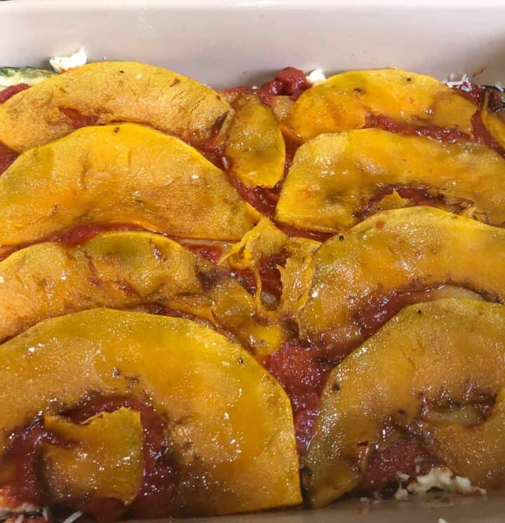 Pumpkin layer. C-shaped sautéed pumpkin slices arranged on top of tomato sauce.