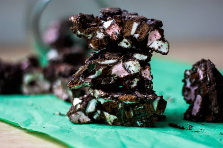 a stack of rock road pieces - chocolate studded with pink and white marshmallows and flecks of green.