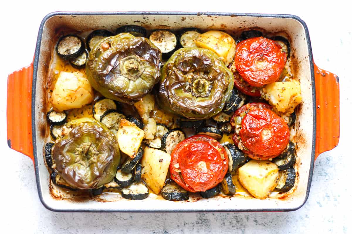 Bird's eye view of finished gemista fresh out of the oven - ugly delicious , slightly charred vegetables.